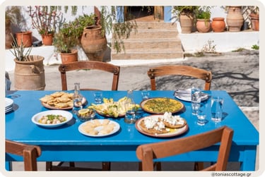 Village in Crete with a table of traditional Cretan food