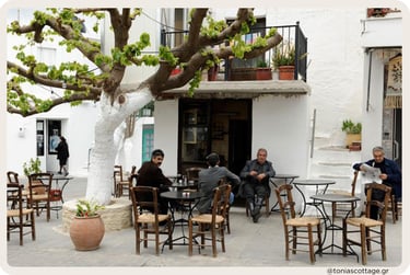 Cretan village café setting in a sunny plateia