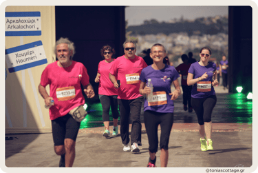 Runners participating in the Crete Half Marathon, moving with determination along the route