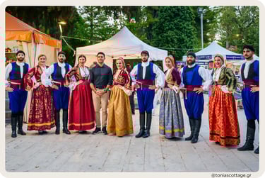 Group performing folk dance in colorful costumes at a festival in Crete