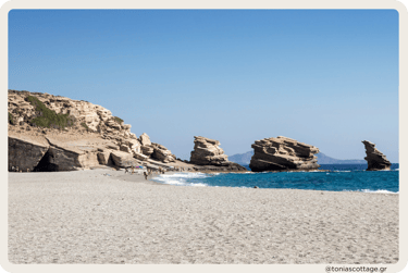 riopetra Beach, Crete, Greece, featuring its iconic three rocks and sandy shoreline