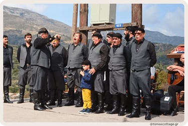 Men and boys in black Cretan clothing standing outdoors