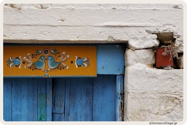 Painting on the wall of an old building in Myrtia, Crete