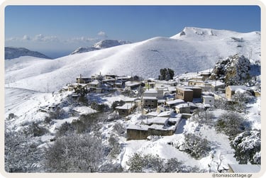 Stone village in Asterousia mountains Crete covered with snow in winter