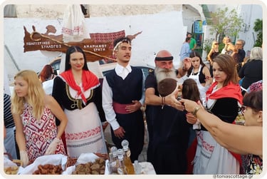 Participants in traditional Cretan costumes at an outdoor event at the Cretan Cuisine Festival.
