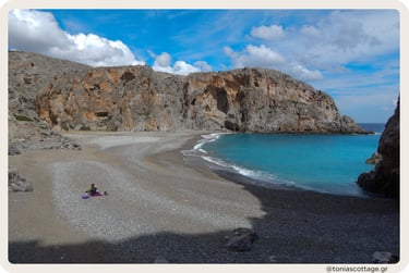 Agiofarago Beach, Crete, with people sitting quietly in the peaceful, empty surroundings