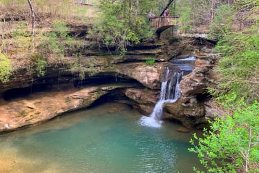 Waterfall flowing into a turquoise pool at Hocking Hills State Park near Logan & Nelsonville Ohio .