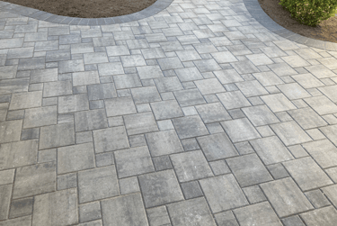 a brick paved walkway with a brick paved walkway