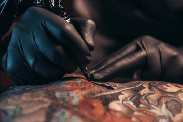Image of the tattooing process on skin