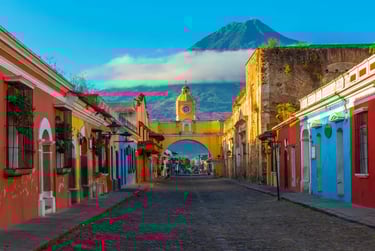 Santa Catalina Arch in Antigua Guatemala with Agua Volcano in the background.