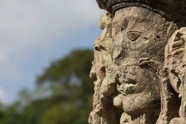 Close-up profile of an ancient Maya stone sculpture carving at the Copan ruins in Honduras.
