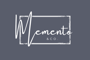 modern, grey and white rectangular logo of Memento & Co. written in script