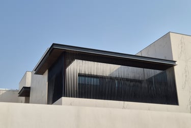 Vertical aluminum louver screen for villa window privacy and modern facade design.