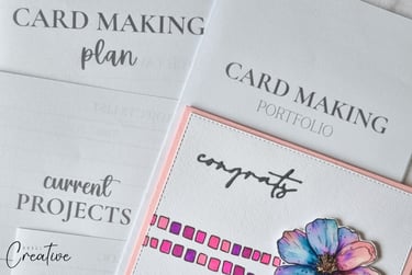 Printed card making planners with handmade card next to them