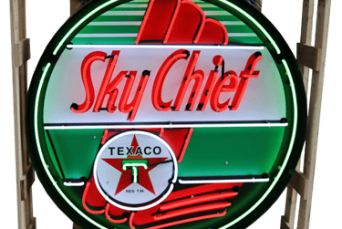 a sky chief neon sign with a sky chief,sky chief sign,sign,texaco sign,