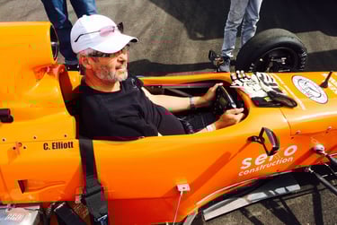 allan barss sitting in an open wheel style racecar 