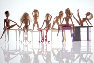 a group of dolls sitting on a table
