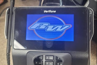 Verifone credit card reader and terminal with a stylus and a blue screen displaying an RW logo.