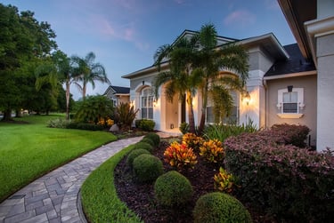 a house with a pathway leading to a driveway