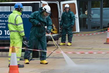 A small group of men cleaning a city walkway