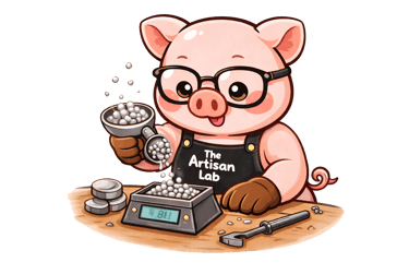 The Artisan Lab Designs mascot Milo is measuring the silver with a scale