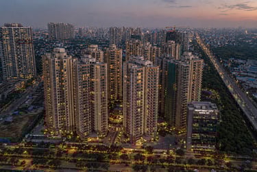 Aerial view of Heartbeat City luxury apartments in Sector 107 Noida at sunset.