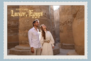 A couple admires the ancient hieroglyphics on stone columns at the Karnak Temple in Luxor, Egypt.