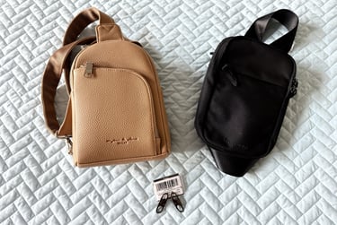 Close up of my anti theft crossbody bag and my husband’s bag with clips used for pickpocket safety