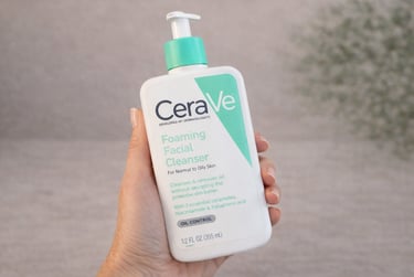 CeraVe Foaming Facial Cleanser for normal to oily skin held in hand