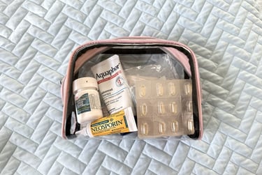 Close up of my clear medication travel bag that keeps medicines and supplements organized on trips