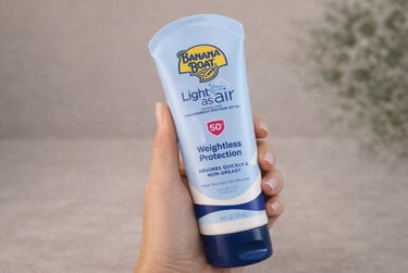 Banana Boat Light As Air SPF 50 lightweight sunscreen lotion held in hand
