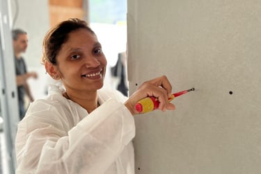 woman holding a tool on construction site