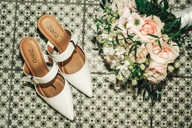 Wedding details flat lay shoes and bouquet elegant styling