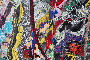 Complex abstract painting with vibrant red, yellow, and blue textures featuring expressive brushstrokes.