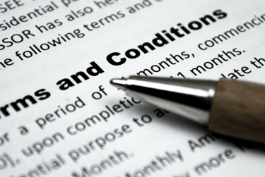 Terms and Conditions page with pen