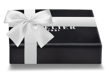 Elegant black Atelier 1951 luxury gift box tied with a white satin ribbon and bow.