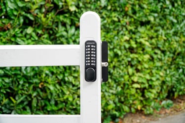 Metal gate with push button lock