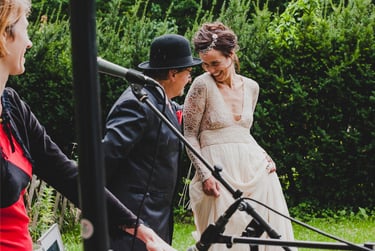 Bride and officiant laughing together.