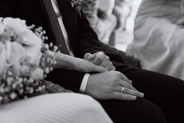 Bride and groom holding hands.