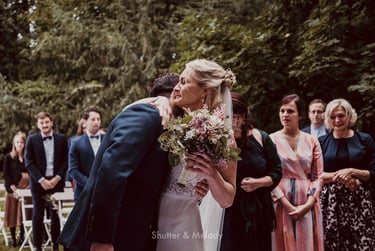 Bride and groom hugging after the wedding ceremony.