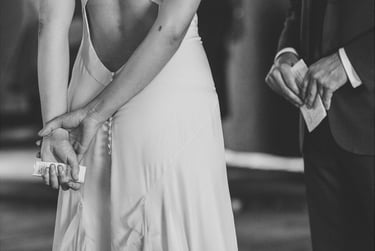 Bride and groom holding their vows.