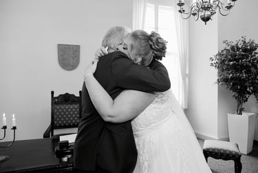 Bride hugging wedding guest at the civil registry.