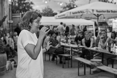 Bride speaking to guests at wedding reception.