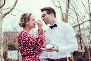 Bride feeding groom wedding cake.