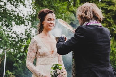 Bride being cleansed with smoke.