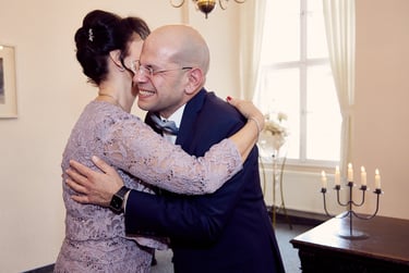 Guest congratulating groom.