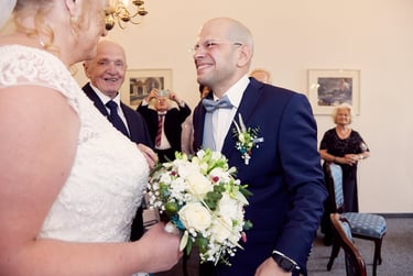 Groom looking at the bride for the first time.
