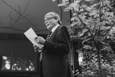 Father of the bride reading from a paper sheet.