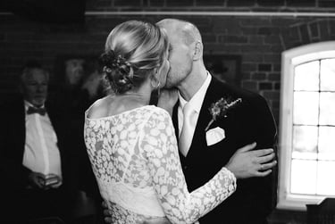 First kiss as a newly wed couple.