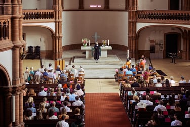 Pastor speaking during a wedding ceremony in Gethsemanekirche.